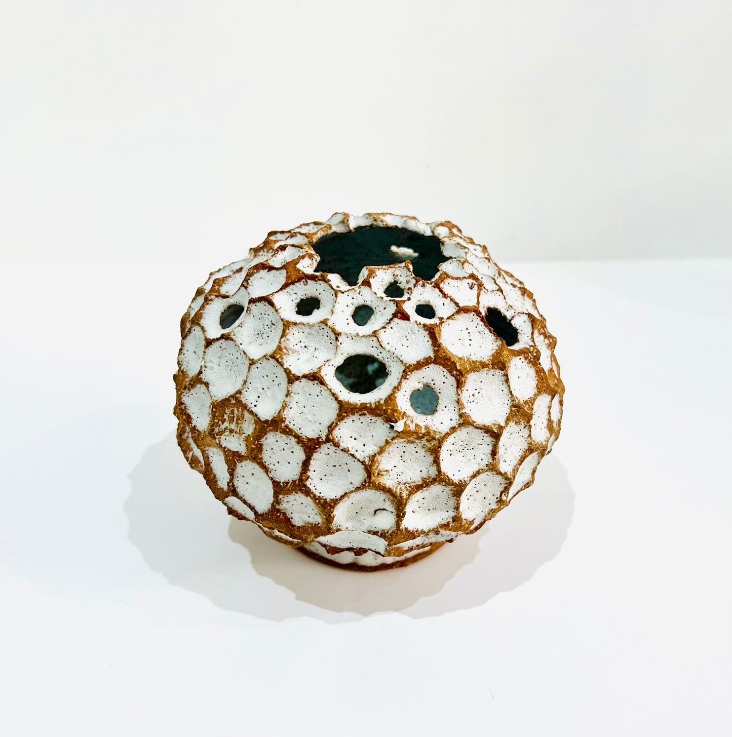 Round white carved vase