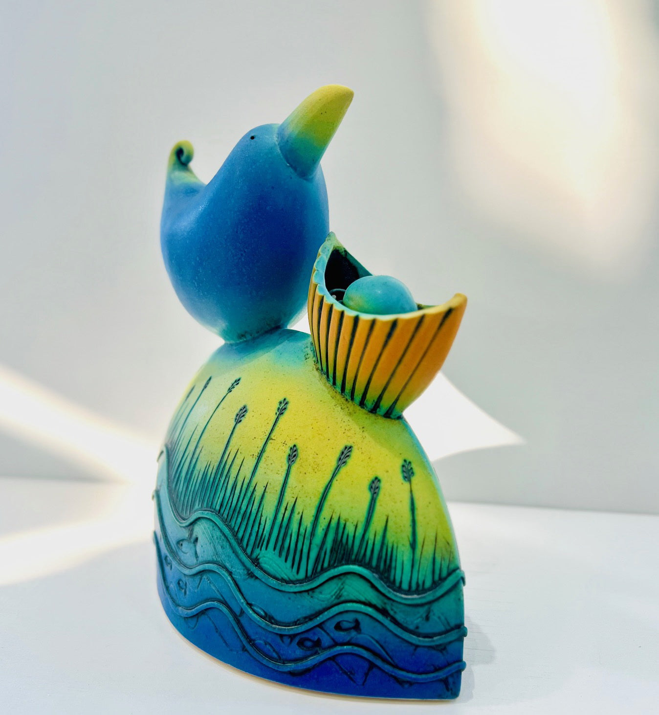 Blue Bird Nesting by the Water Edge