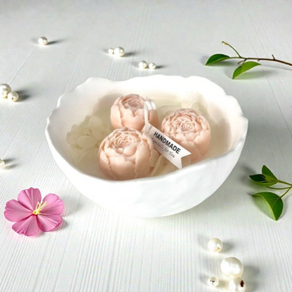 Decorative scented candle with peonies