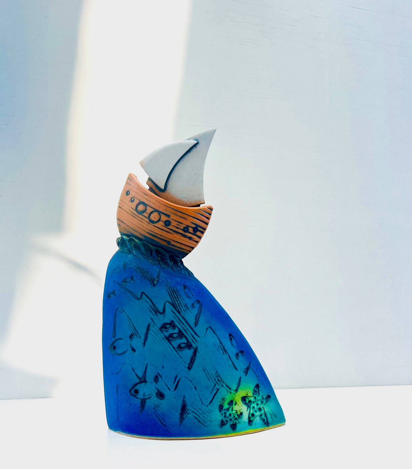 Orange Yacht at the Crest of the Wave