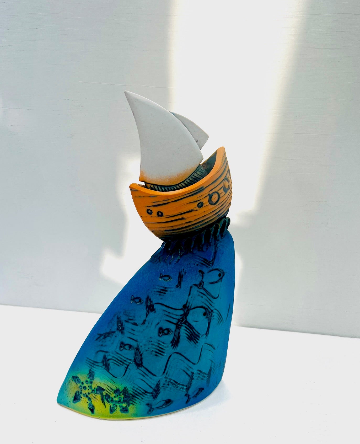 Orange Yacht at the Crest of the Wave