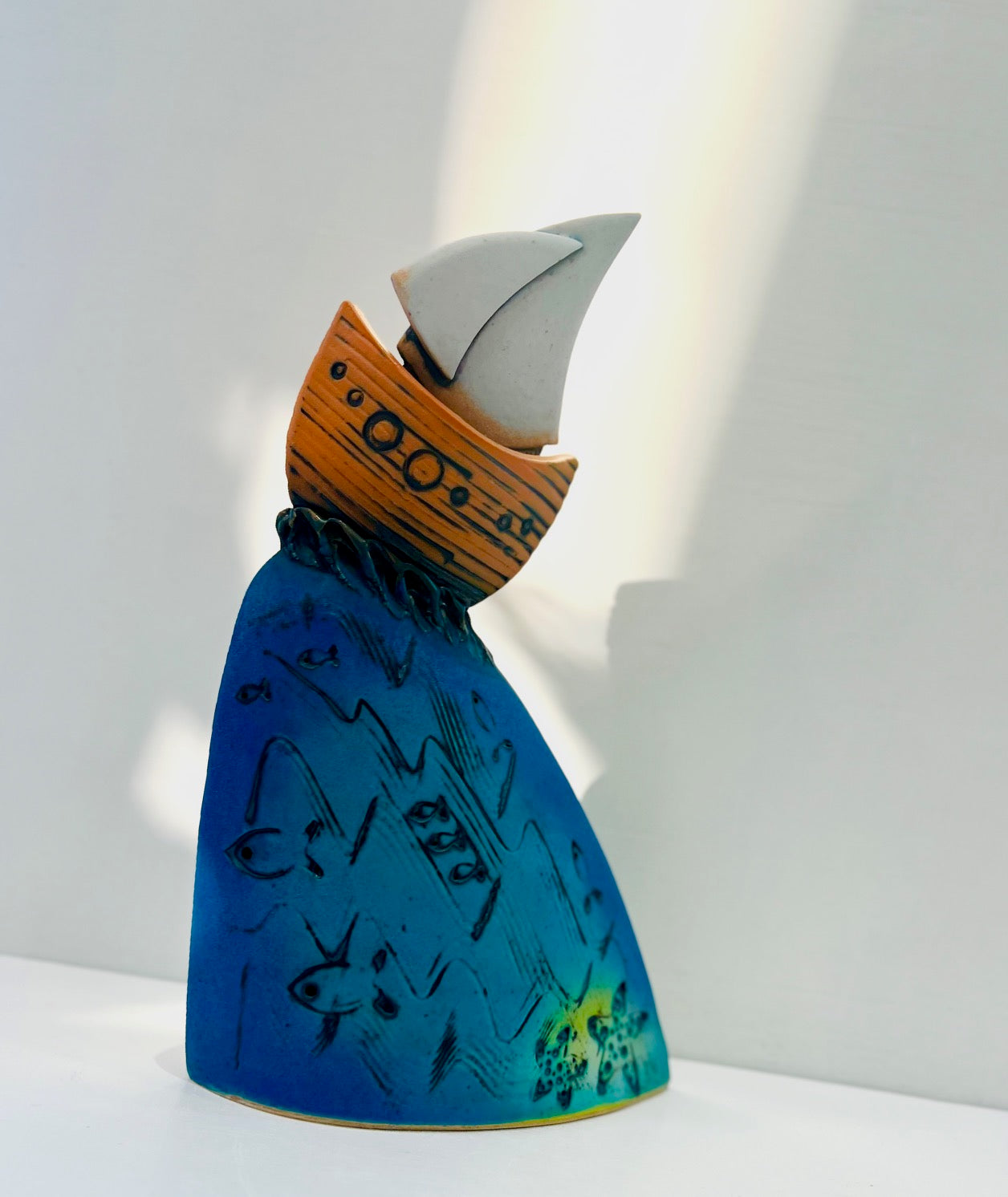 Orange Yacht at the Crest of the Wave