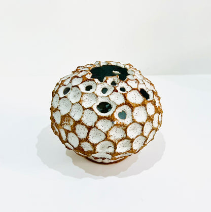 Round white carved vase