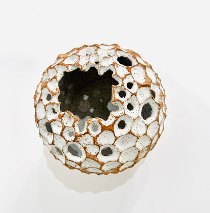 Round white carved vase