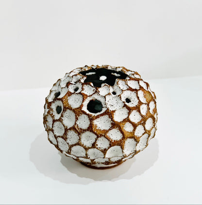 Round white carved vase