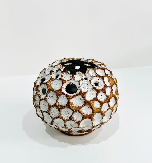 Round white carved vase